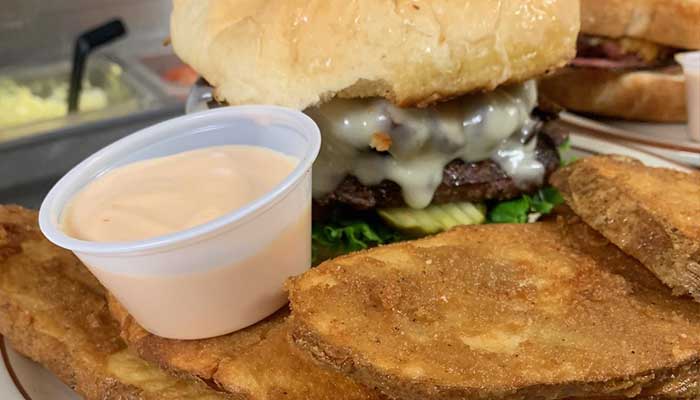 The best lunch and dinner sandwiches at The Cove of Twin Falls includes cheeseburgers served with a side of Idaho potato planks